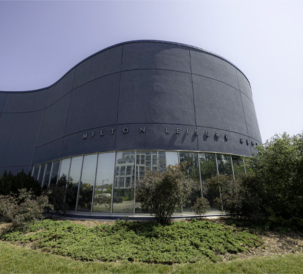 A building with the words Milton Leisure Centre with blue sky behind it