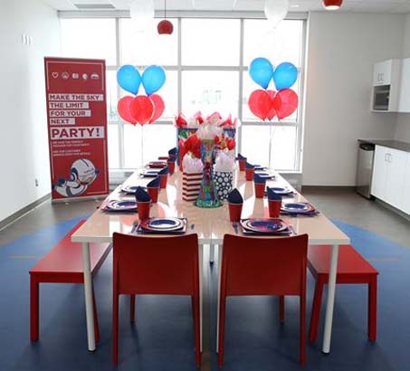 A room with balloons and party decorations