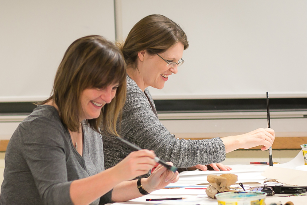 Ladies painting in an art classroom