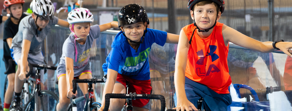 a group of young boys trying the track.