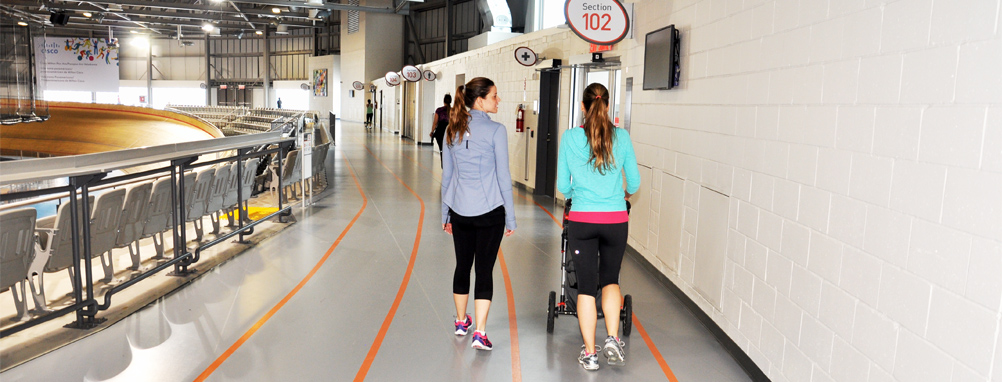 2 ladies walking on the walking track