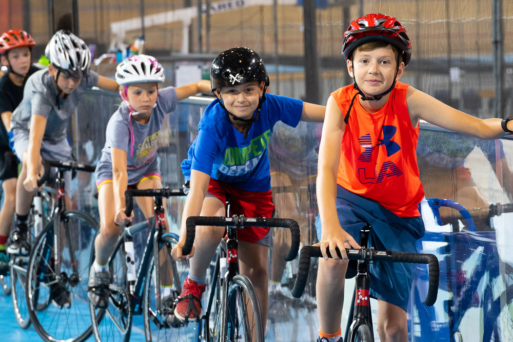 a boy on a bike at the velodrome