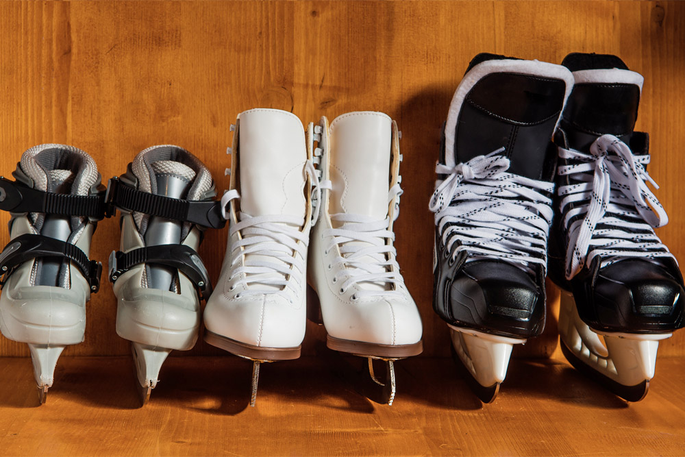 Hockey skates and figure skates lined up