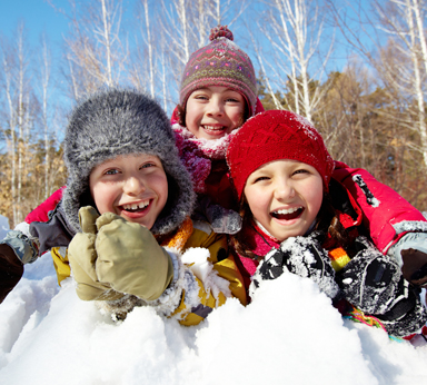 group of kids playing in the snow