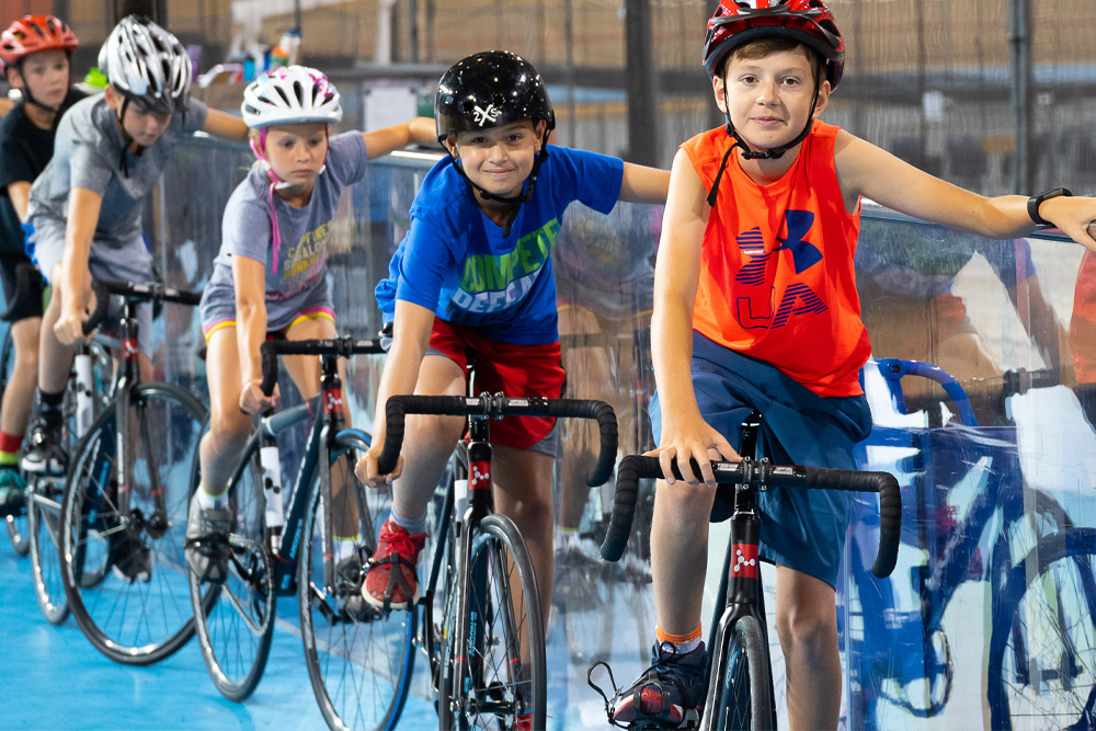 A group of people on bikes at the Velodrome