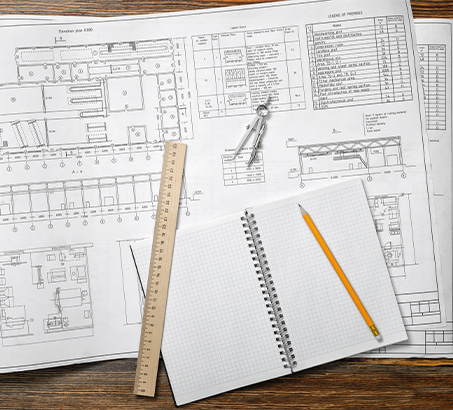 Floor plans spread out on a table