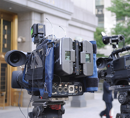 A film camera outside of a building