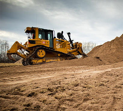 A bulldozer moving dirt in a construction area