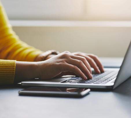 Hands on a laptop