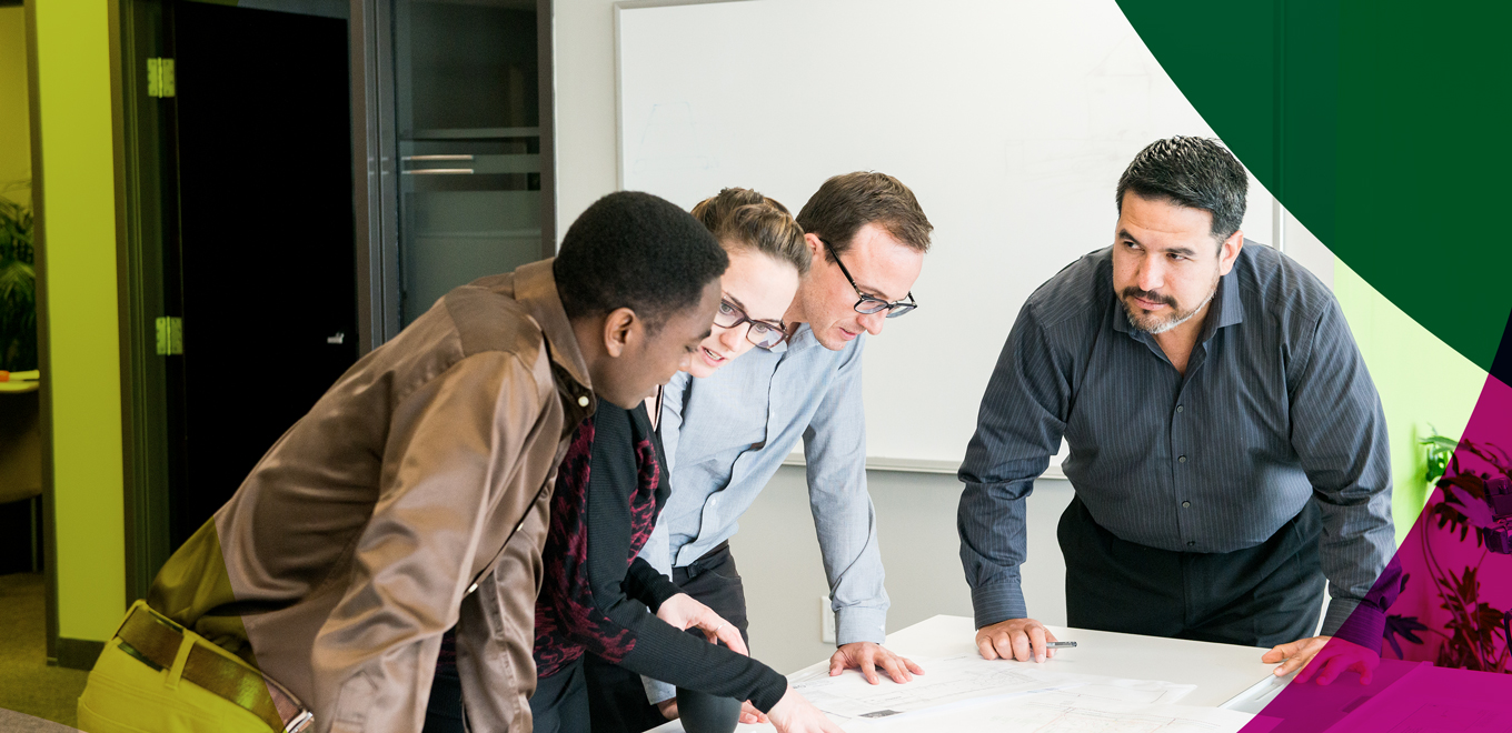 Professionals around a table working as a team