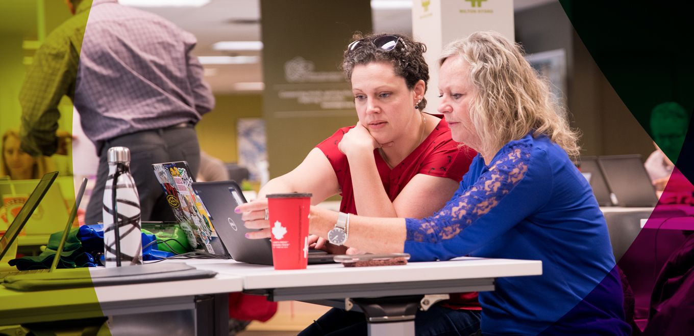 professionals sitting at a table communicating