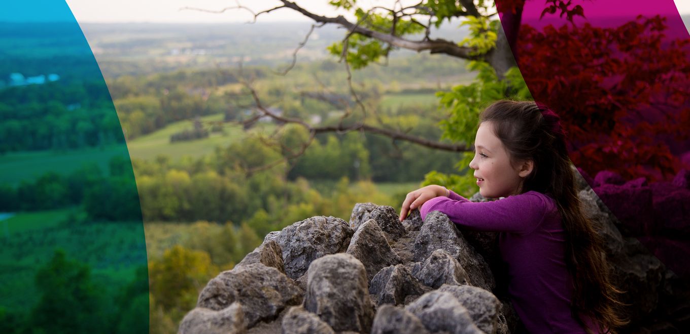 Little girl looking at the view at a look out