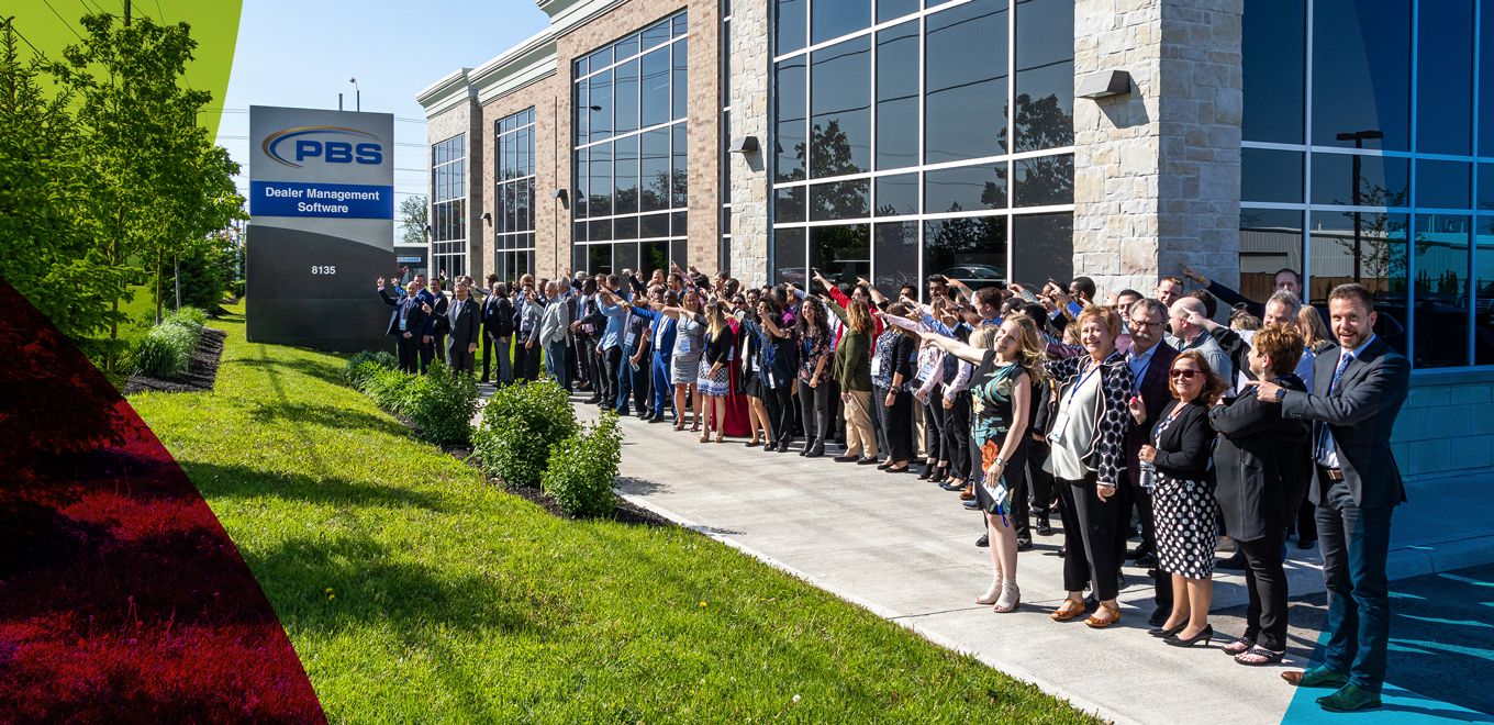 Picture of staff of PBS standing outside of the building