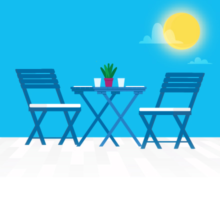 table and two chairs outdoors on sunny day