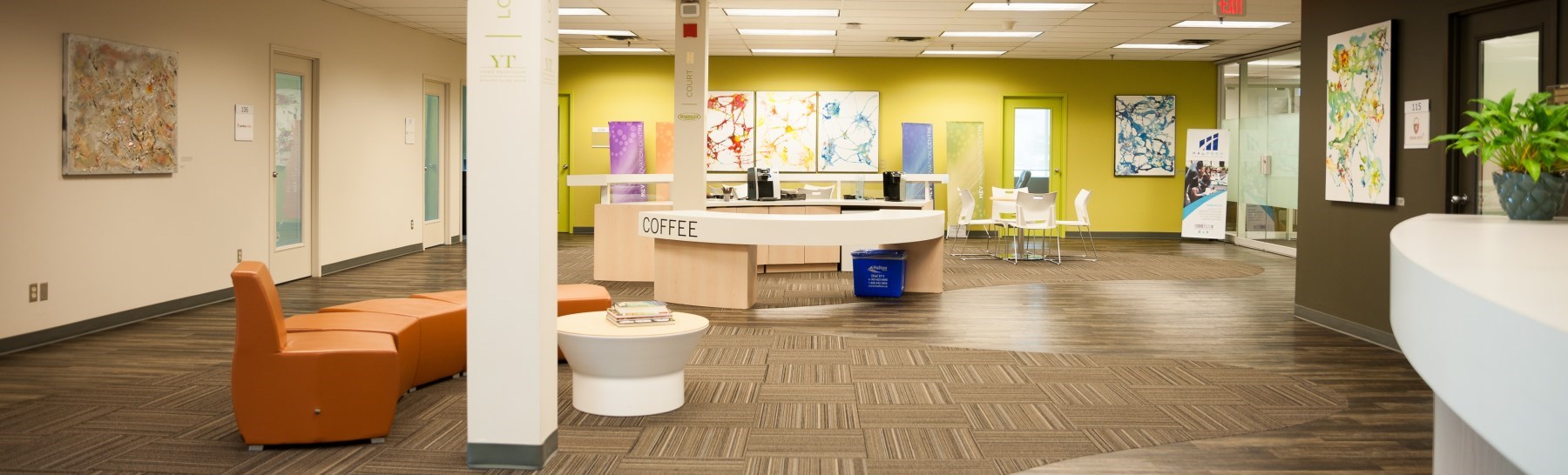 a man and woman at a highboy table talking at the Innovation Centre