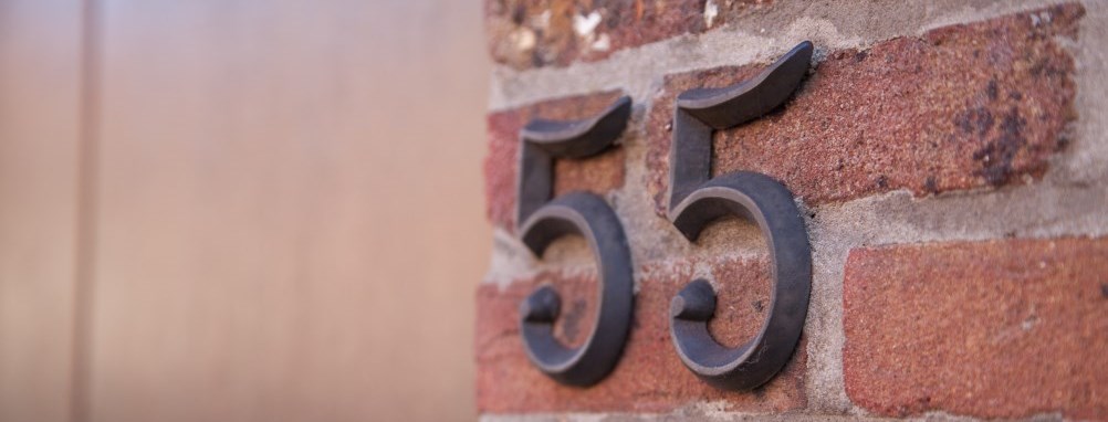 House number on brick wall