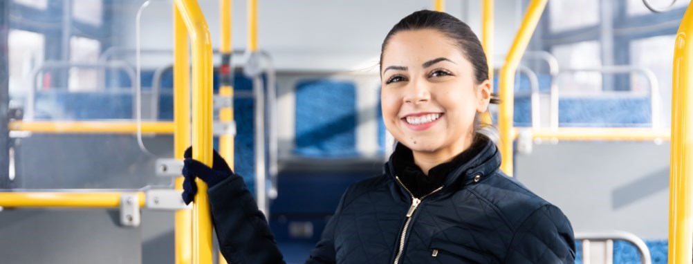 Teenage student riding bus