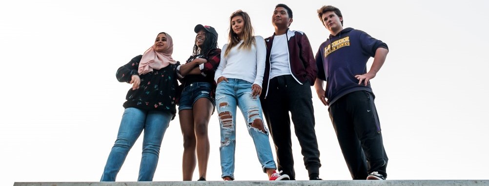 4 youth standing on a wall in Milton