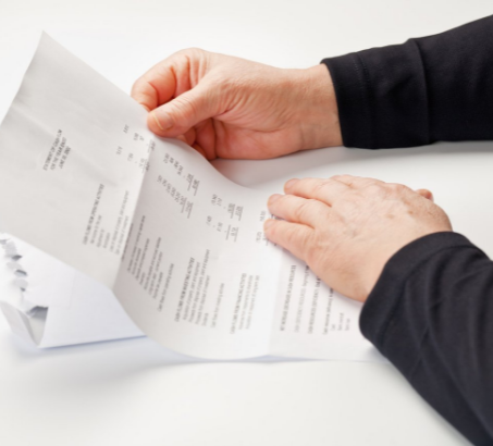 Hands holding a tax document