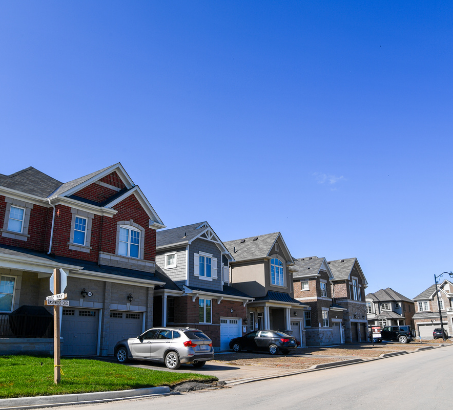 Row of houses with a blue sky behind them