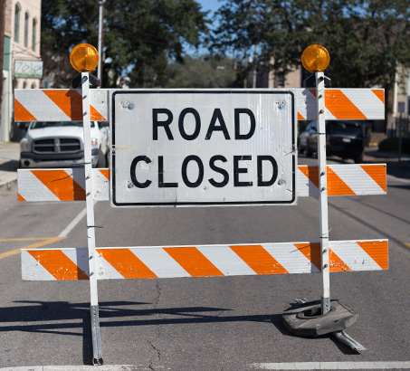 A road closure sign blocking off a road