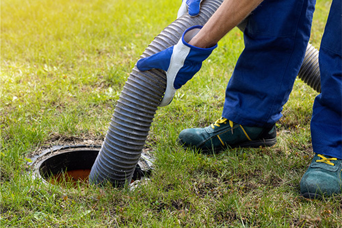 A person installing a septic system