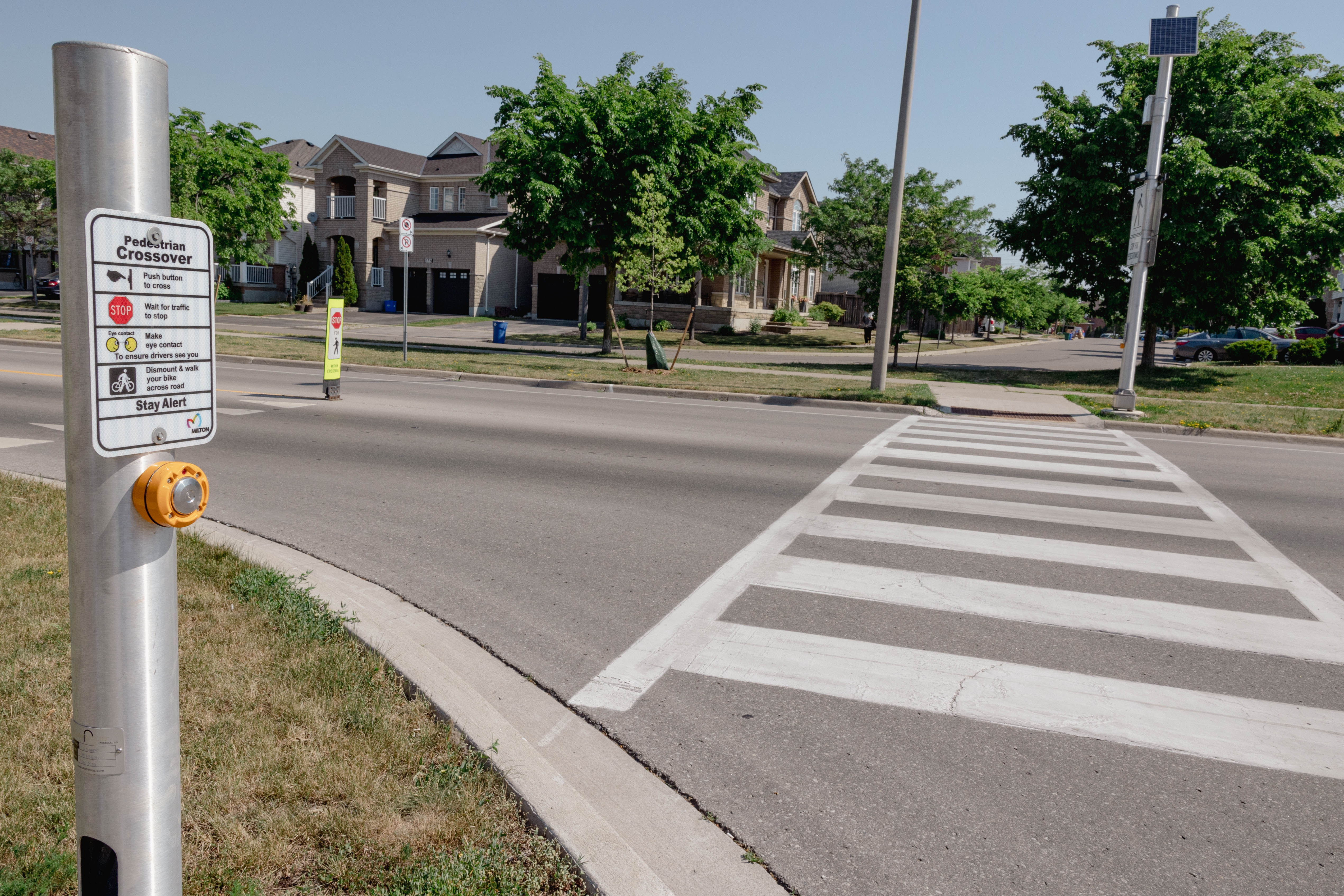 A crosswalk with flashing lights