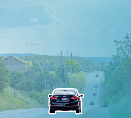 A car driving down a two-lane road