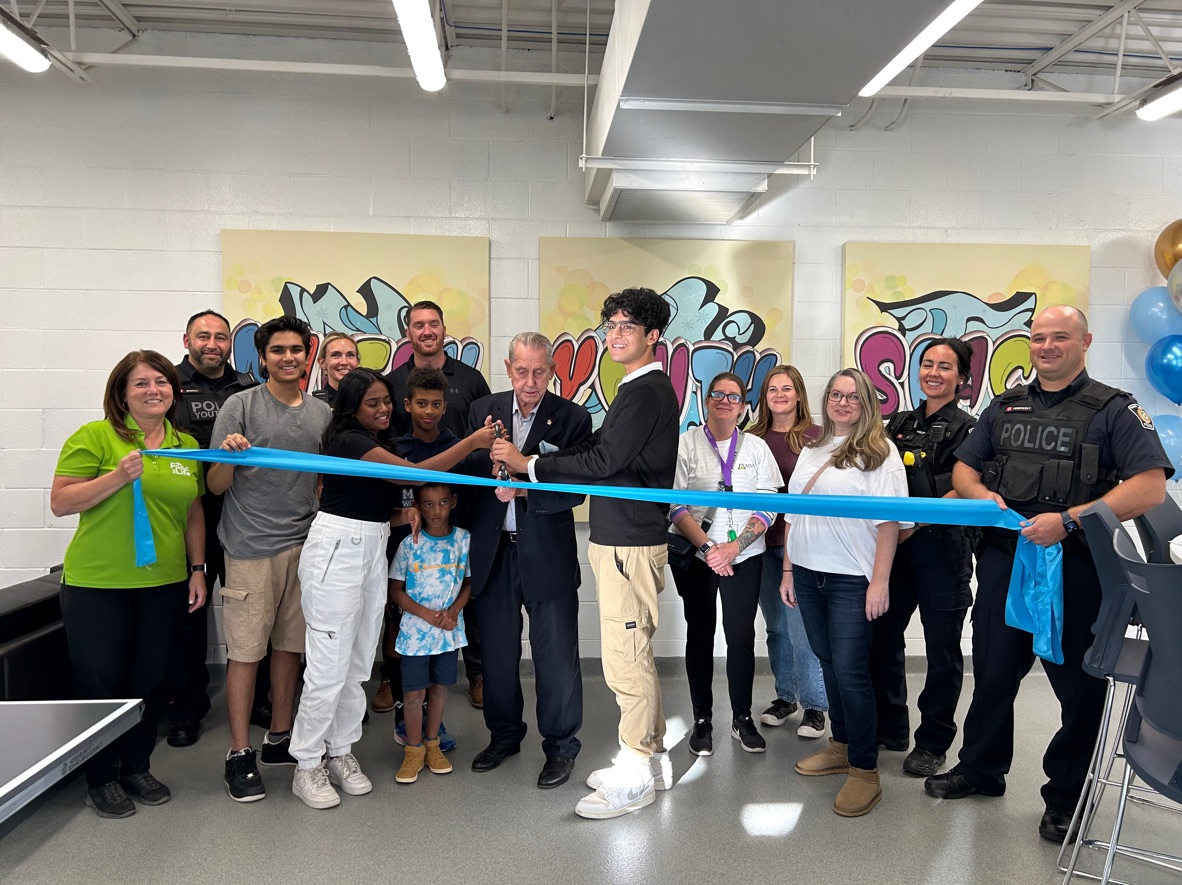 Mayor cutting ribbon at Youth Space opening