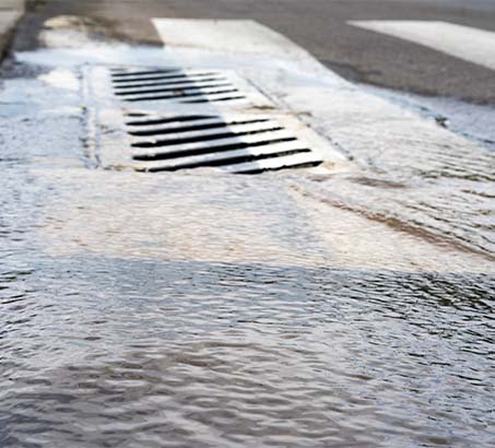 Water flowing into a sewer grate