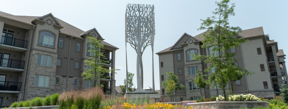 Milton public art sculpture of an abstract metal flower in a public park