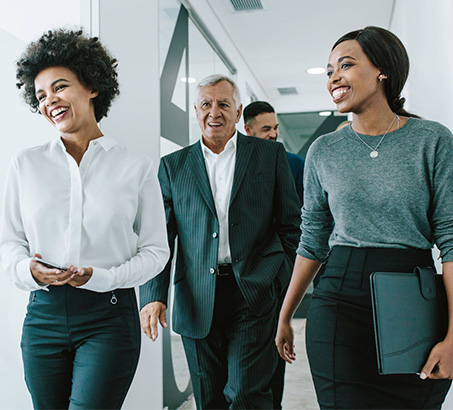 A group of professionals walking in a hallway