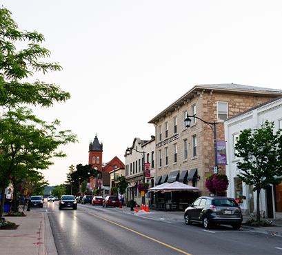 A street with cars and buildings lining the road